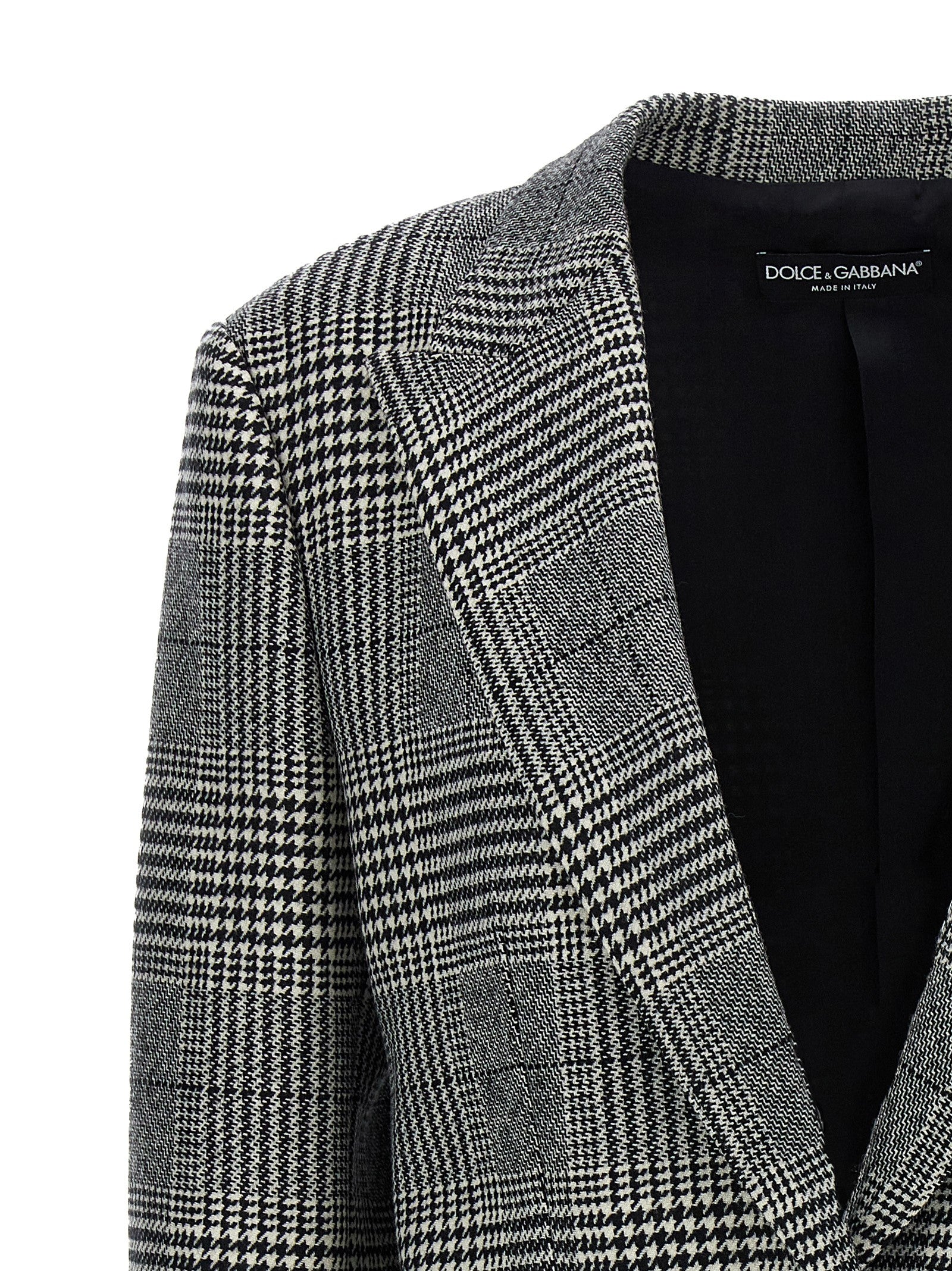 Blazer en laine bicolore Dolce & Gabbana, coupe élégante avec revers et boutons, porté sur un mannequin.