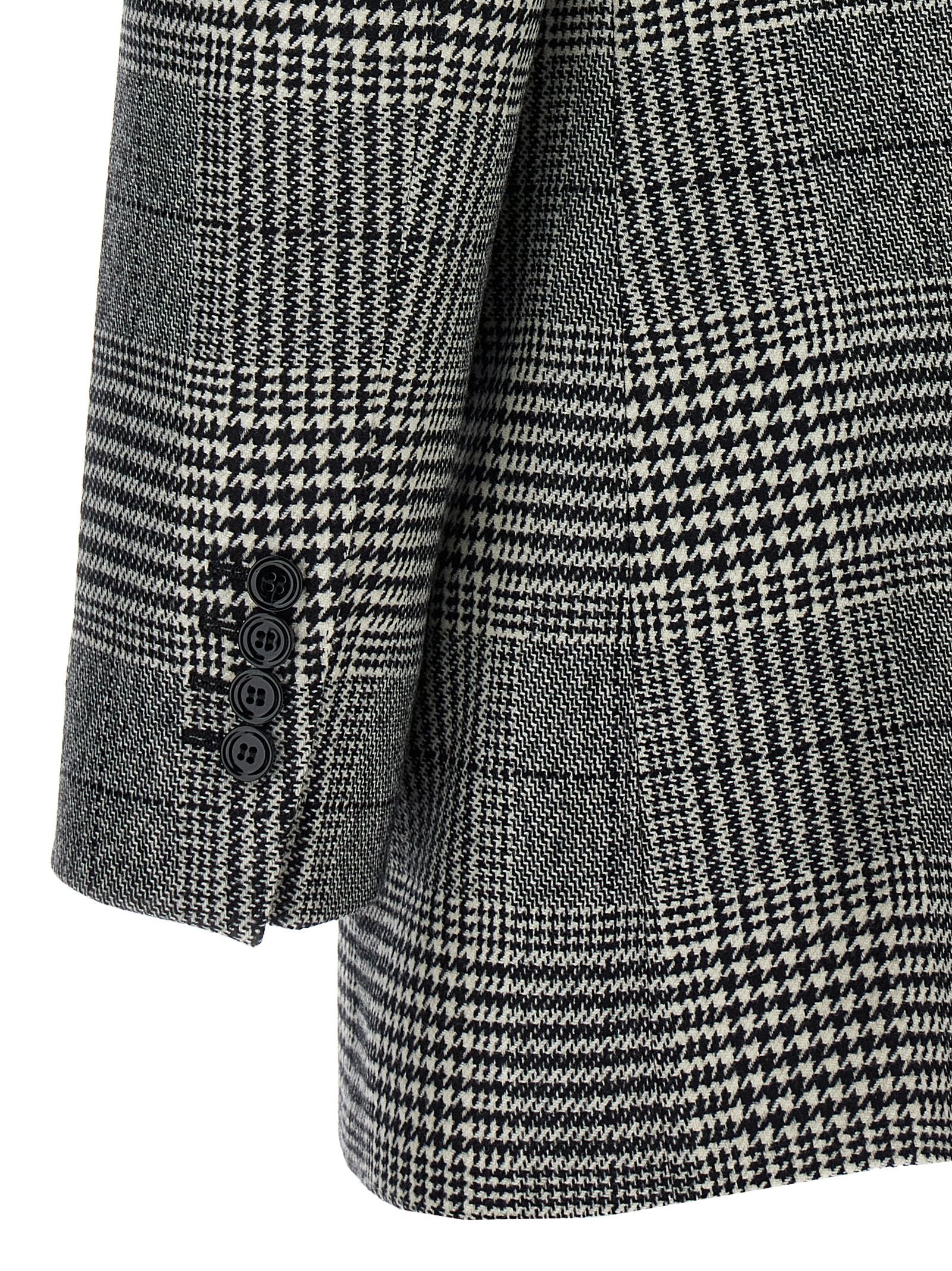 Blazer en laine bicolore de Dolce & Gabbana, élégant et moderne, porté sur un mannequin pour une tenue sophistiquée.