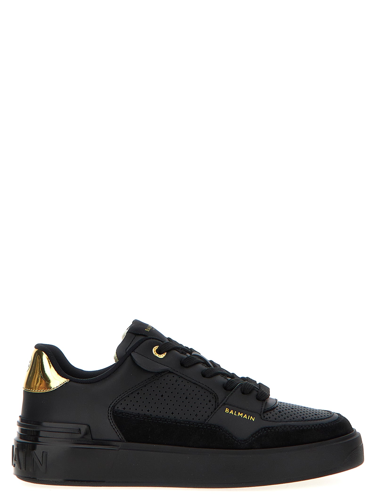 Sneakers noires en veau, style Balmain, avec détails élégants en cuir et semelle blanche, pour un look tendance et sophistiqué.