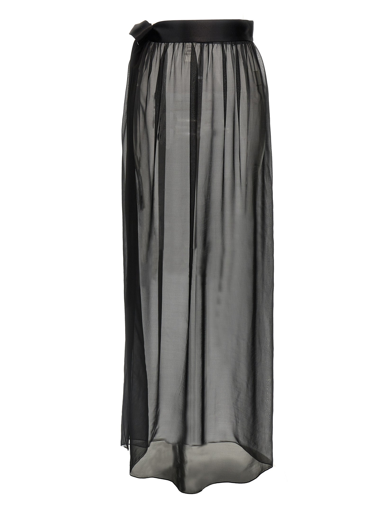 Jupe courte en soie noire de Dolce & Gabbana, coupe moulante et élégante, portée avec style.