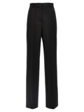 Costume de smoking noir en laine vierge de Dolce & Gabbana, détails élégants et coupe sophistiquée.