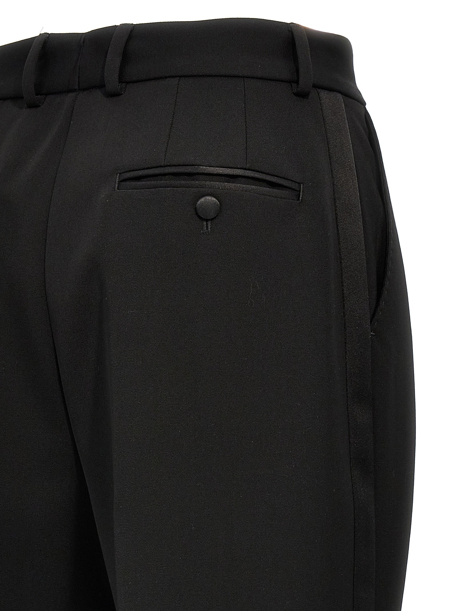 Costume de smoking noir en laine vierge de Dolce & Gabbana, veste élégante avec détails sophistiqués.