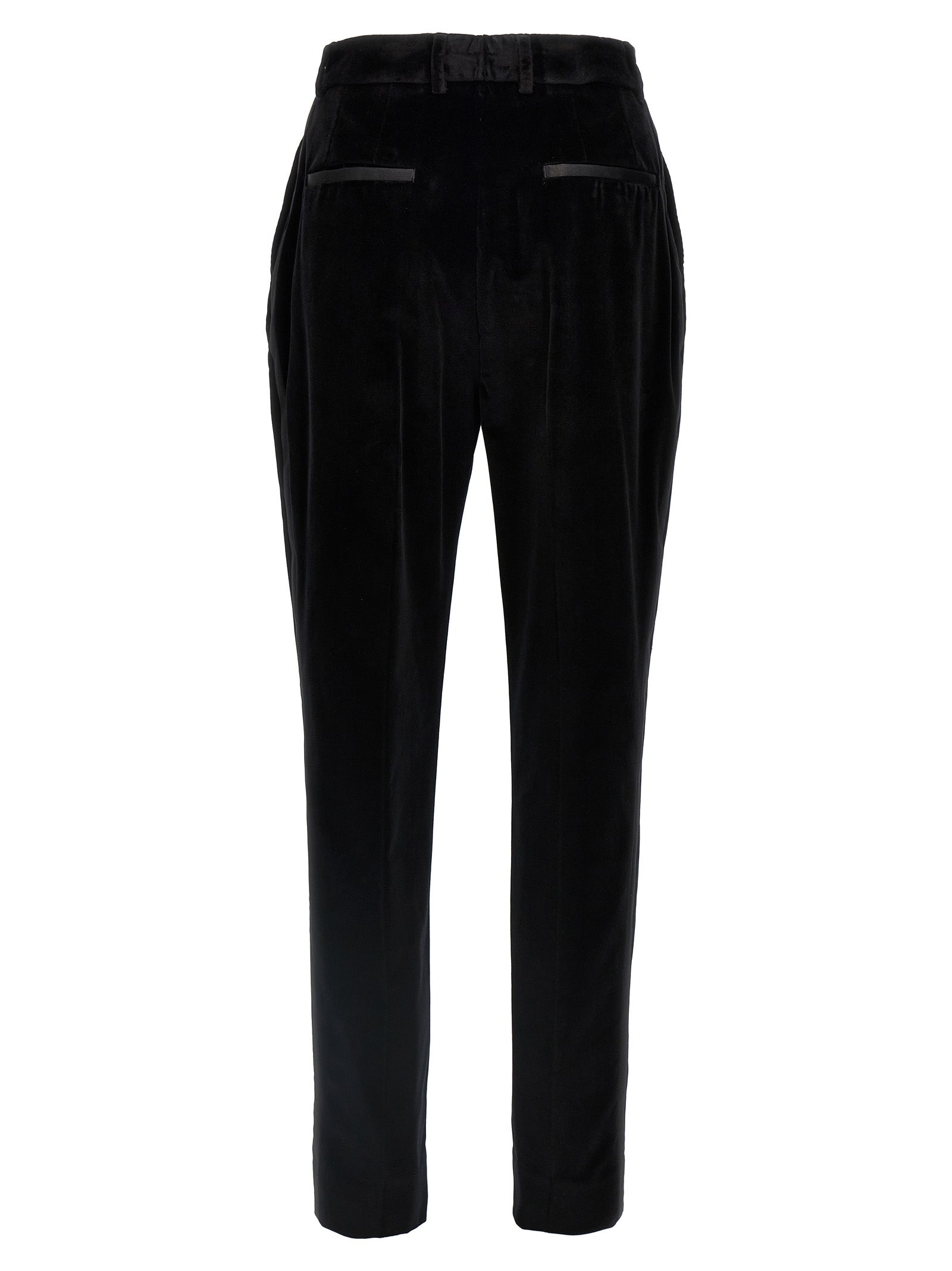 Pantalons de costume en coton noir de Dolce & Gabbana, style élégant et classique, visibles sur le modèle.