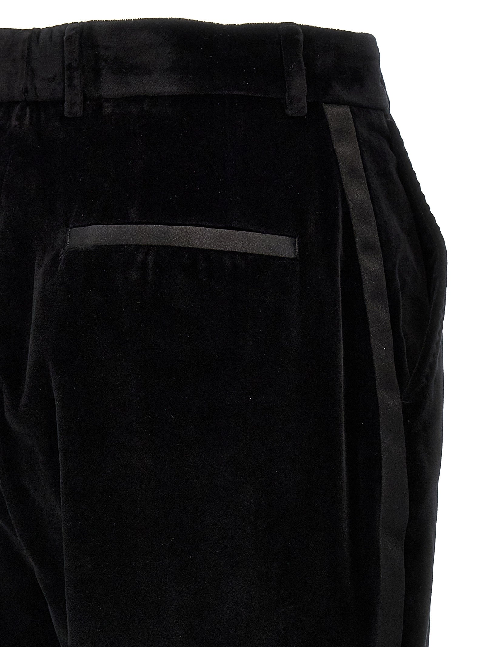 Pantalons habillés en coton noir de Dolce & Gabbana, style élégant et moderne pour femmes ou hommes.