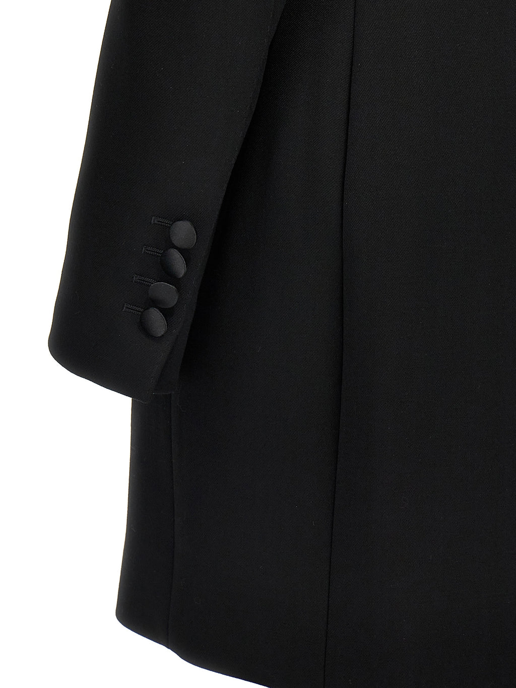 Veste blazer en laine vierge noire de Dolce & Gabbana, coupe élégante et moderne, portée sur un fond neutre.