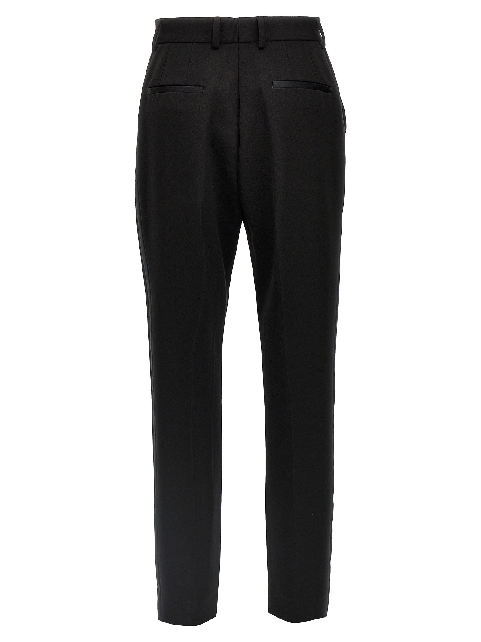 Costume de smoking noir en laine vierge de Dolce & Gabbana, veste élégante avec boutons noirs et coupe sophistiquée.
