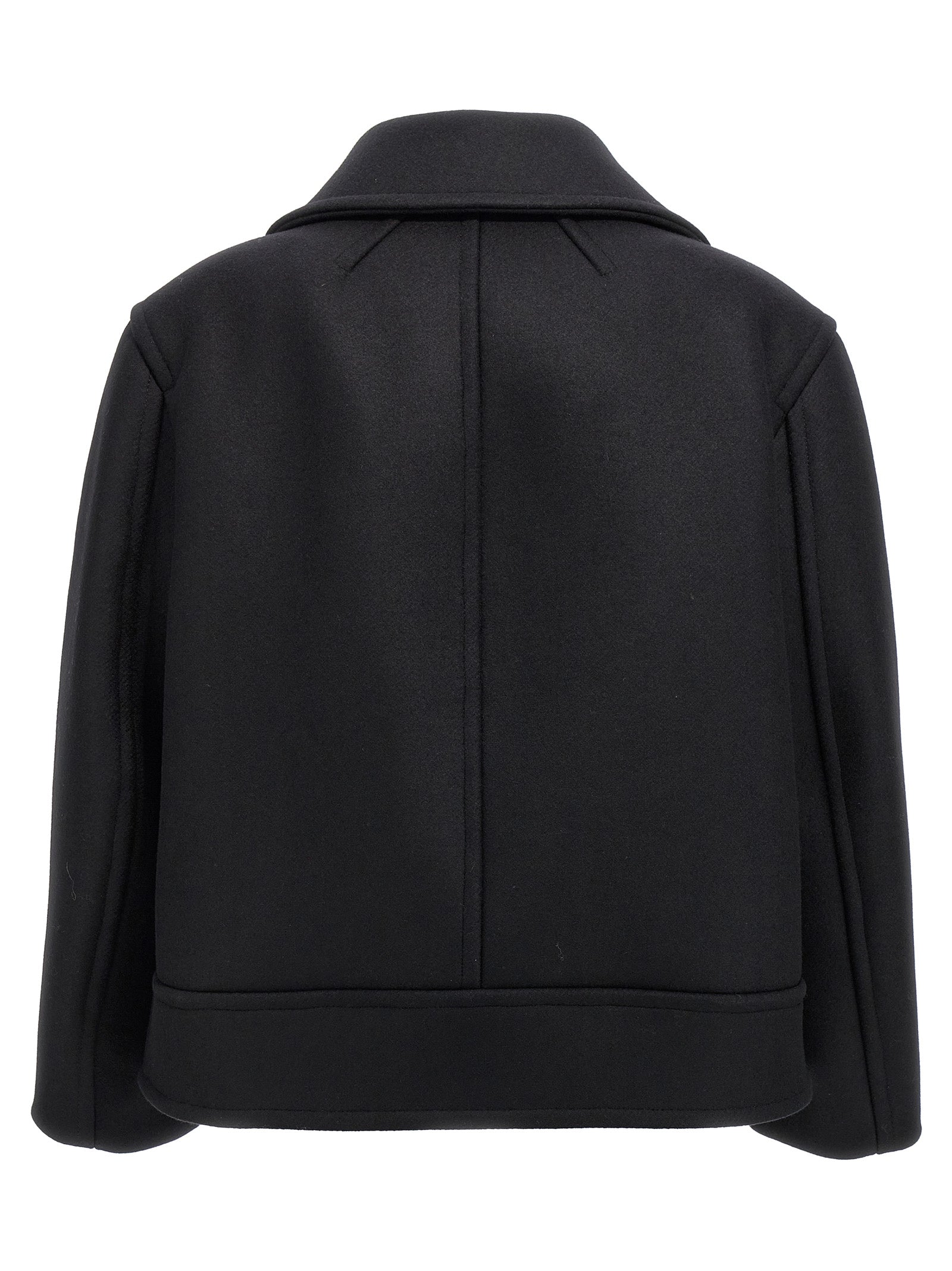 Manteau en laine vierge noir de Saint Laurent, coupe élégante, porté sur un modèle, détails de finition visibles.