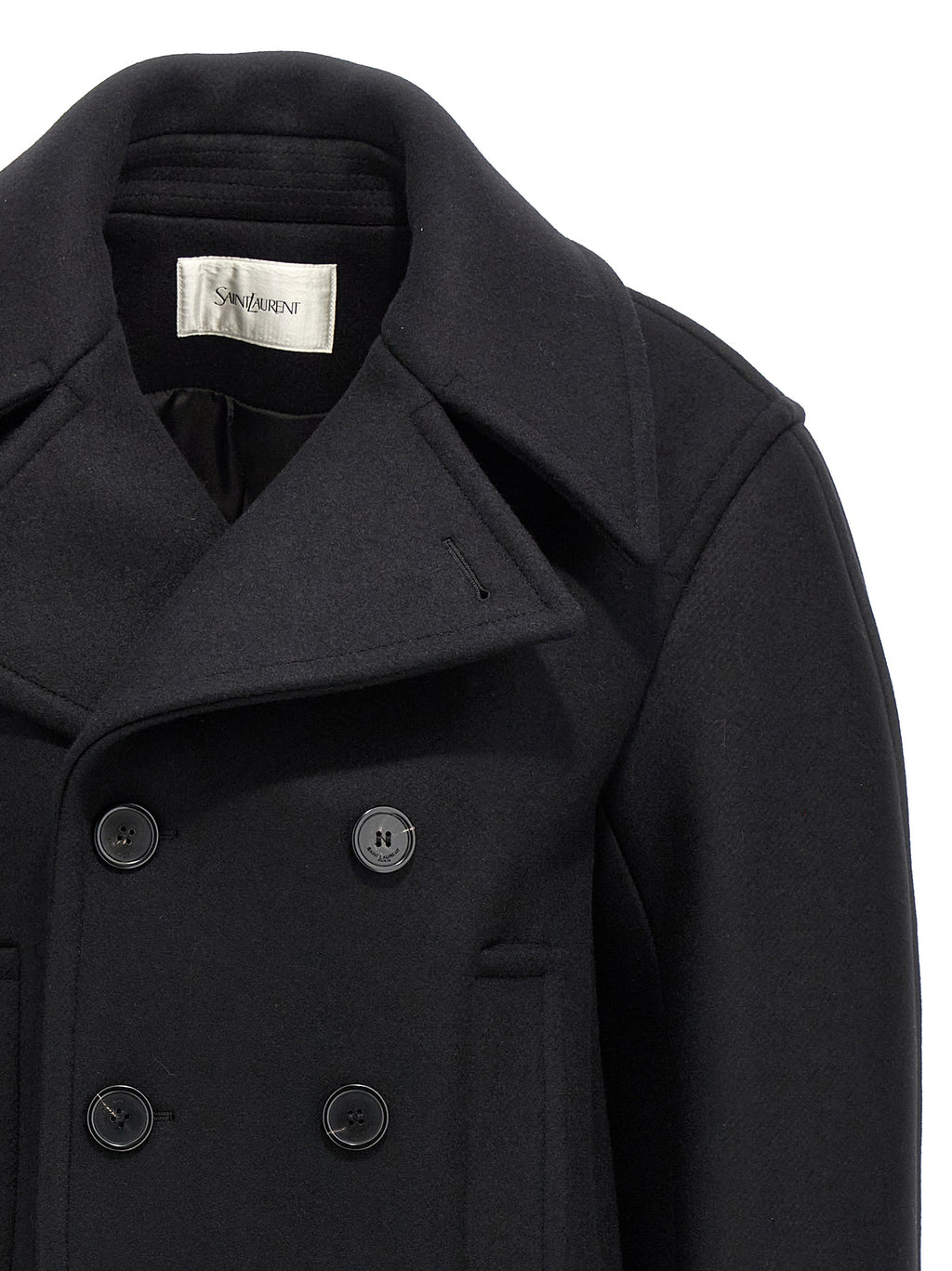 Manteau en laine vierge noire de Saint Laurent porté par un mannequin, détails élégants et coupe sophistiquée visible sur l'image.