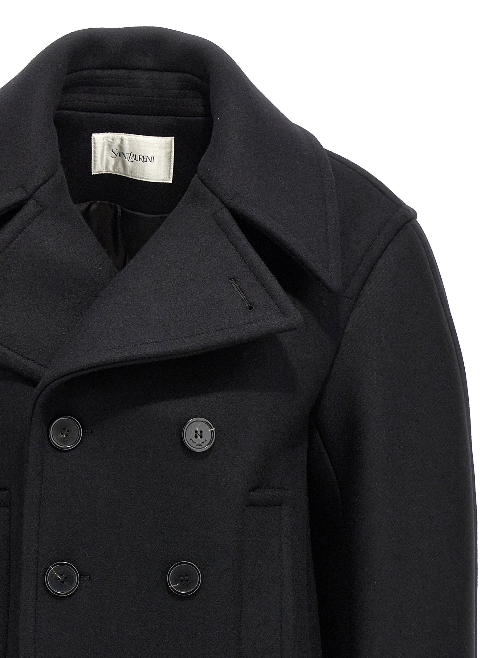 Manteau en laine vierge noire de Saint Laurent porté par un mannequin, détails élégants et coupe sophistiquée visible sur l'image.