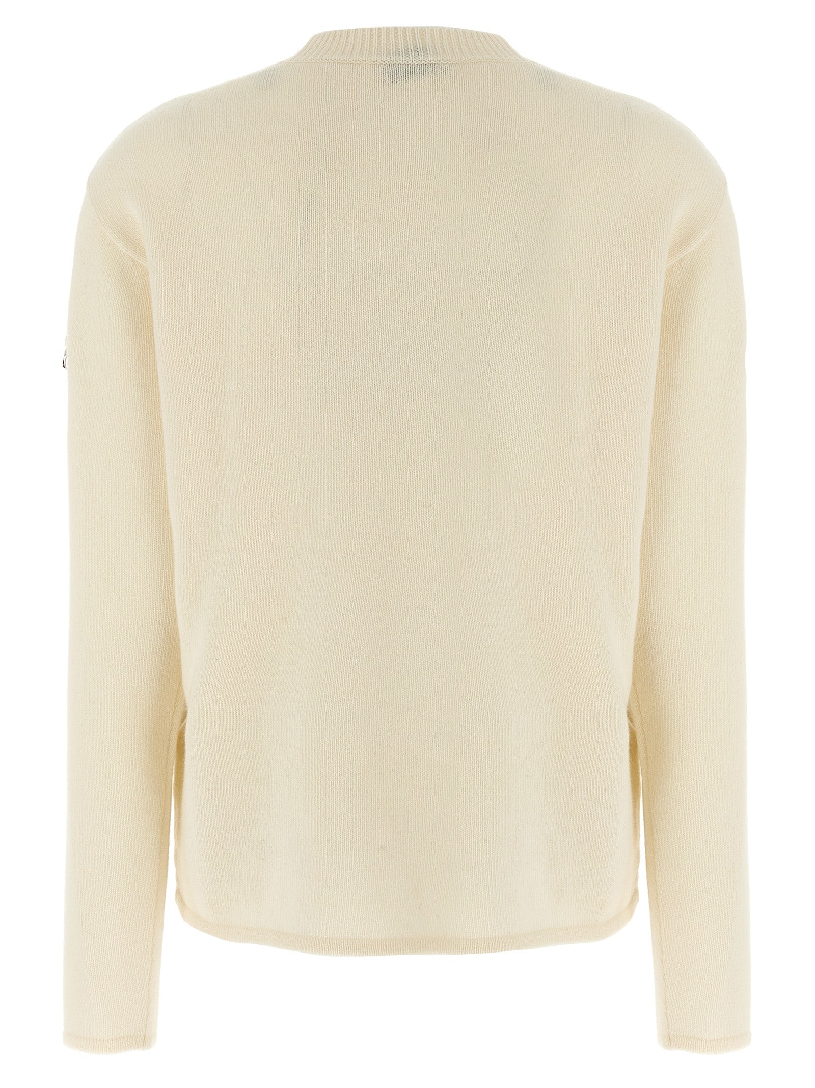 Cardigan blanc en laine MONCLER GENIUS porté sur un modèle, détails de texture et coupe élégante visibles.