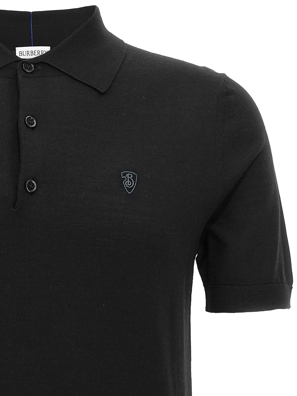 Polo en laine noire de Burberry, chemise classique avec col et boutons, tissu doux et élégant.