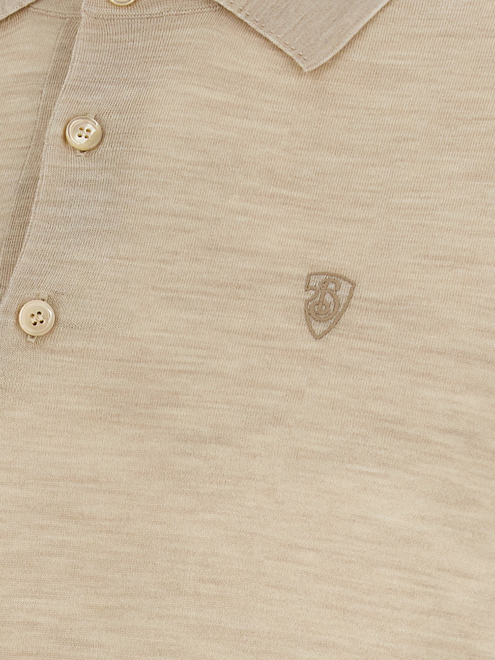 Chemise polo en laine beige de Burberry, vue de face, avec col classique et logo brodé.