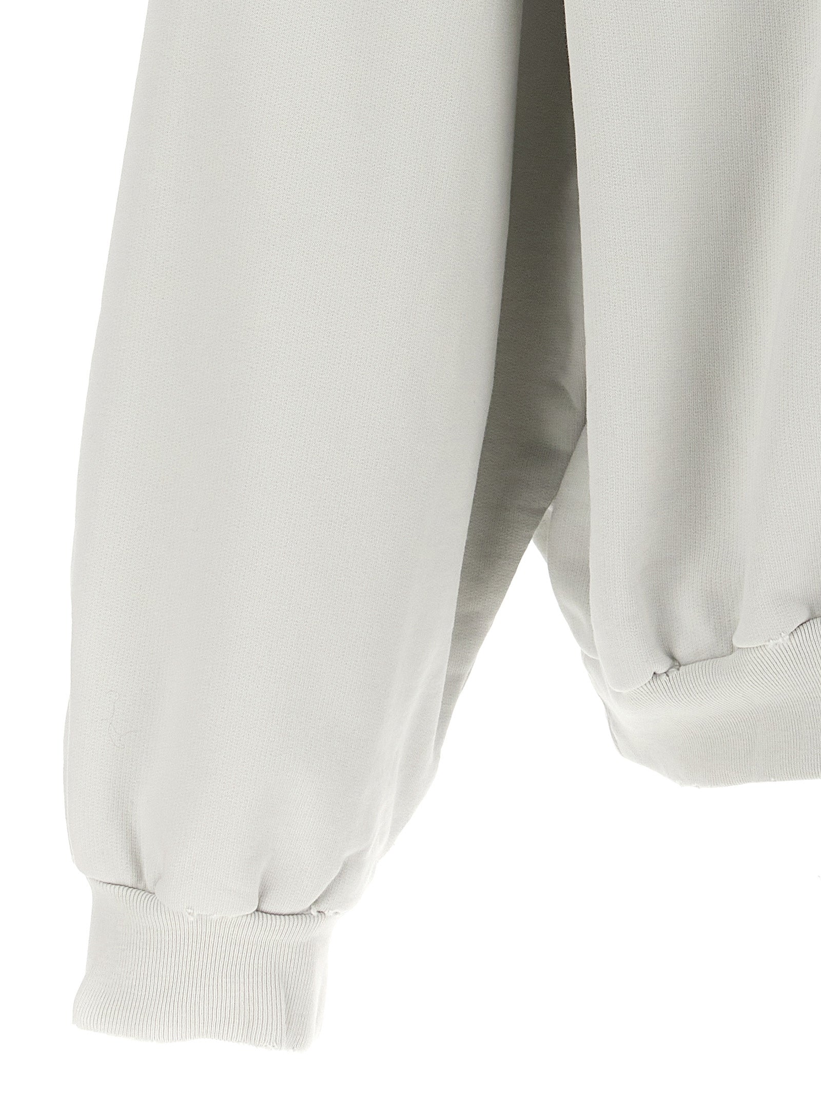 Sweat-shirt blanc en coton de la marque Balenciaga, coupe décontractée et logo discret visible sur le devant.