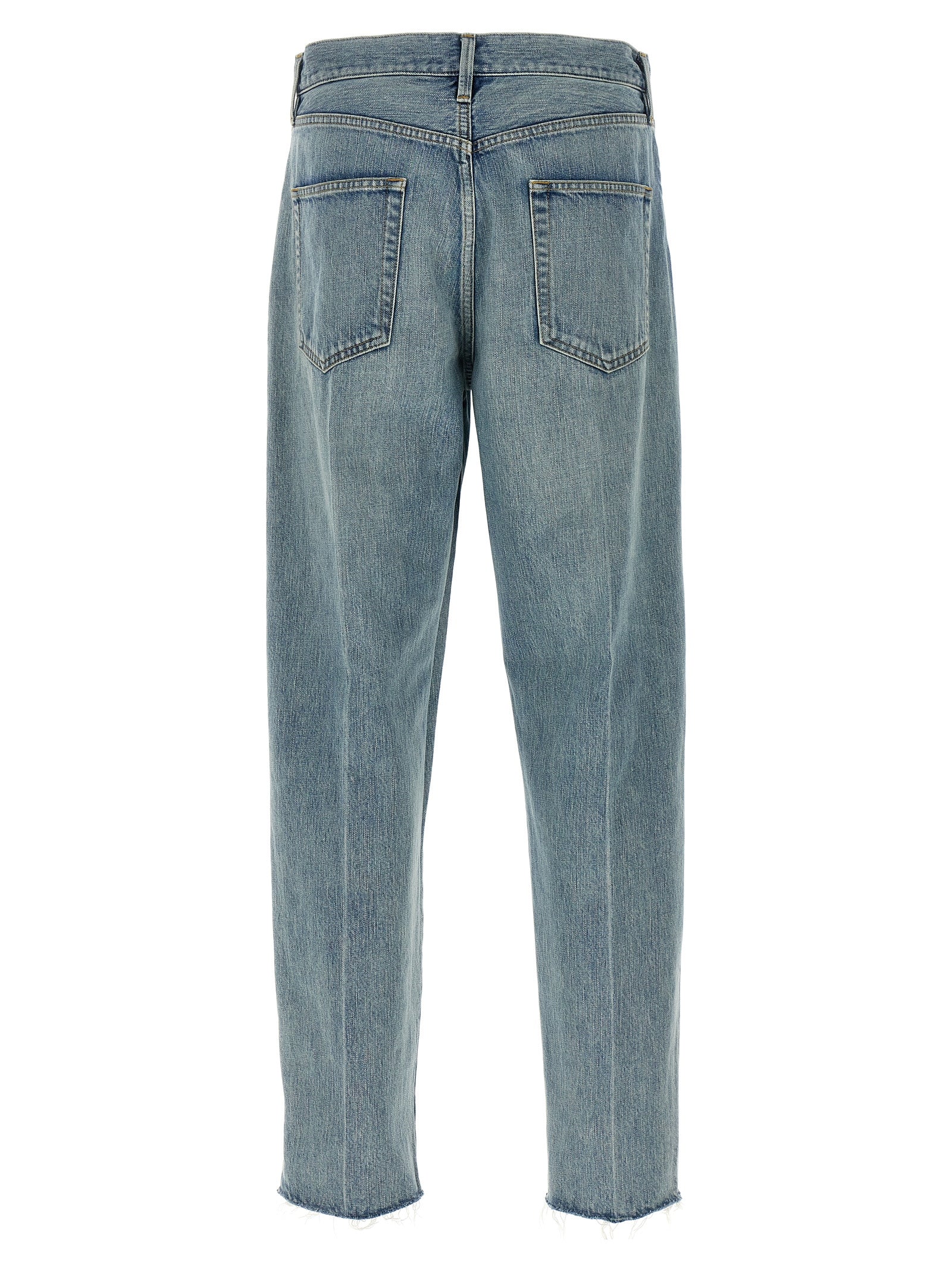 Jeans en denim bleu Fear Of God en coton, coupe classique avec détails de couture visibles, mode décontractée et tendance.