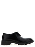 Chaussures Saint Laurent en cuir d'agneau noir, oxfords et derby élégants pour homme, avec couture soignée et semelle en cuir.