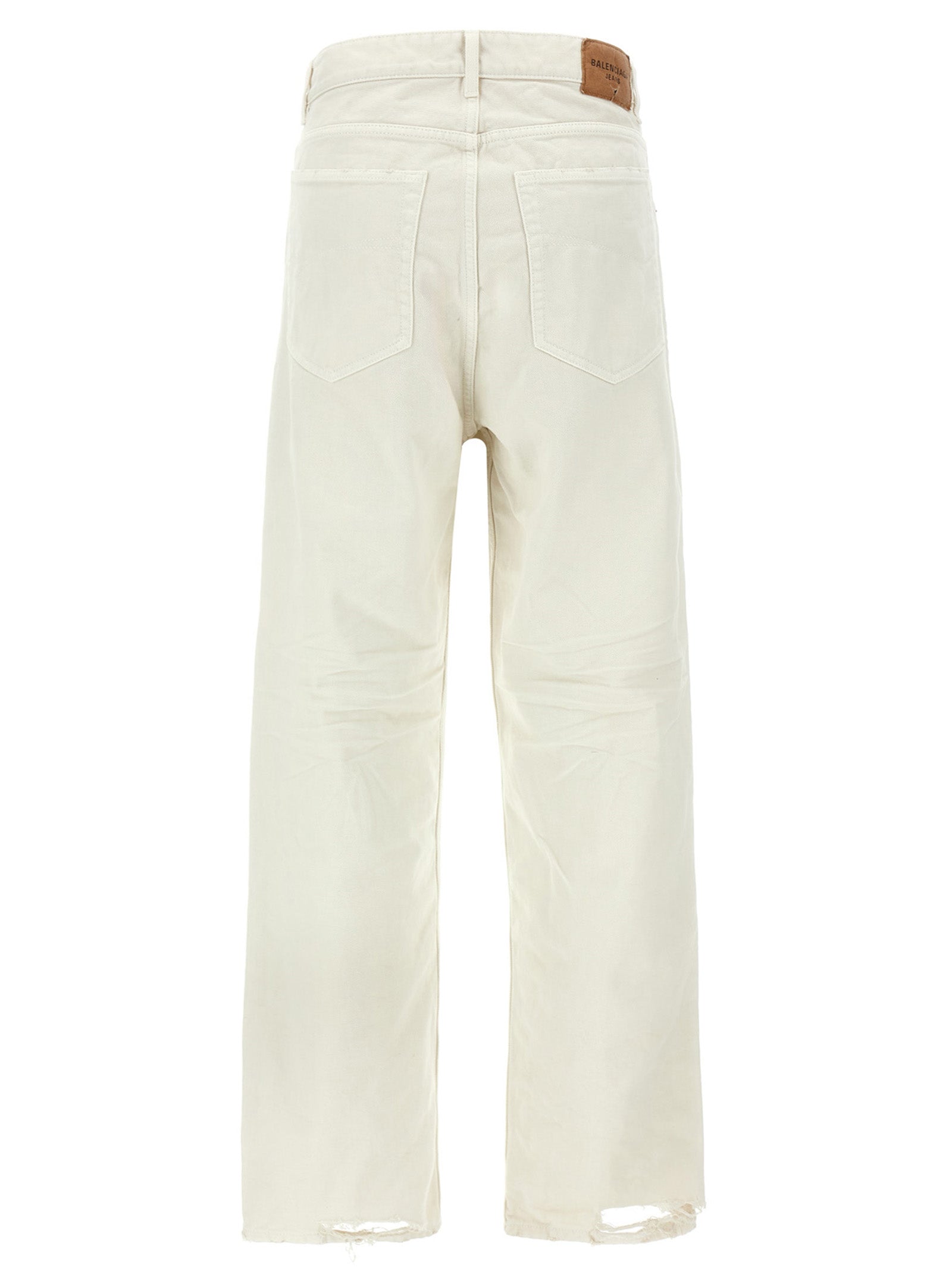Jeans en denim blanc Balenciaga en coton avec coupe classique, visibles en gros plan sur fond neutre.