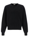 Sweatshirt en coton noir de Saint Laurent, vêtement décontracté avec logo discret, porté par un mannequin.