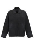 Veste longue en coton noir de Balenciaga, style élégant et moderne, visible en détail sur cette image.