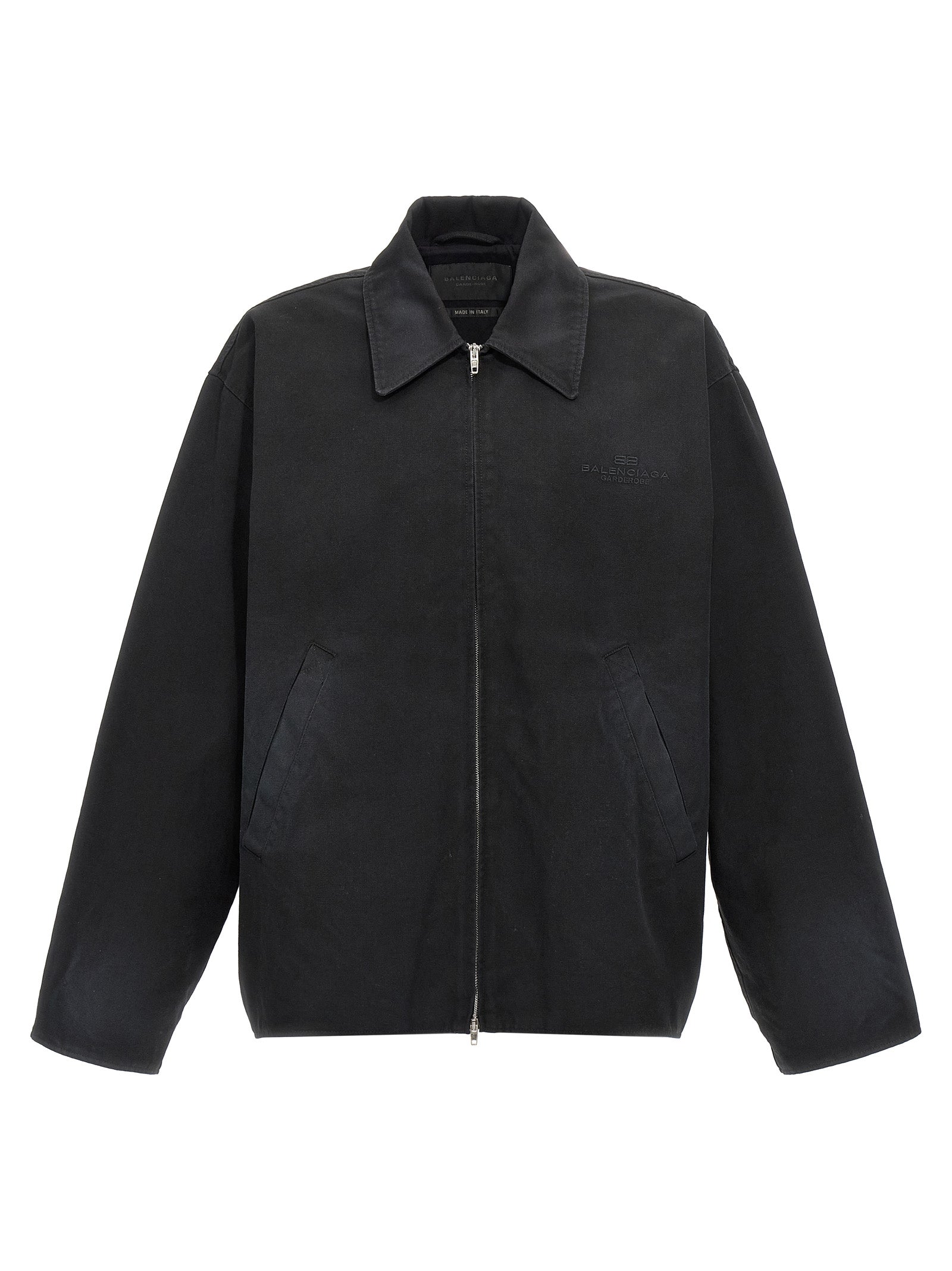 Veste longue en coton noir de Balenciaga, style élégant et moderne, visible en détail sur cette image.