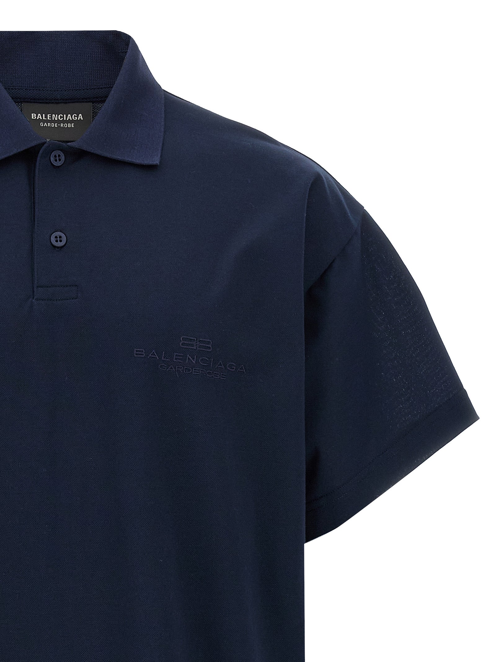 Chemise polo en coton bleu Balenciaga, vue de face, détails du col et logo discret visible.