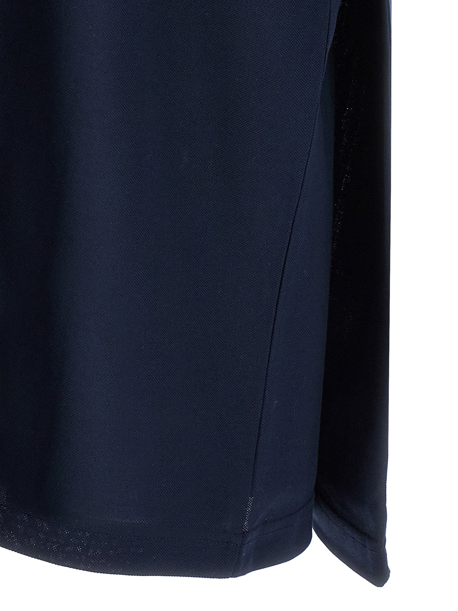 Chemise polo en coton bleu Balenciaga, vue de face avec col et boutons visibles, élégante et décontractée.