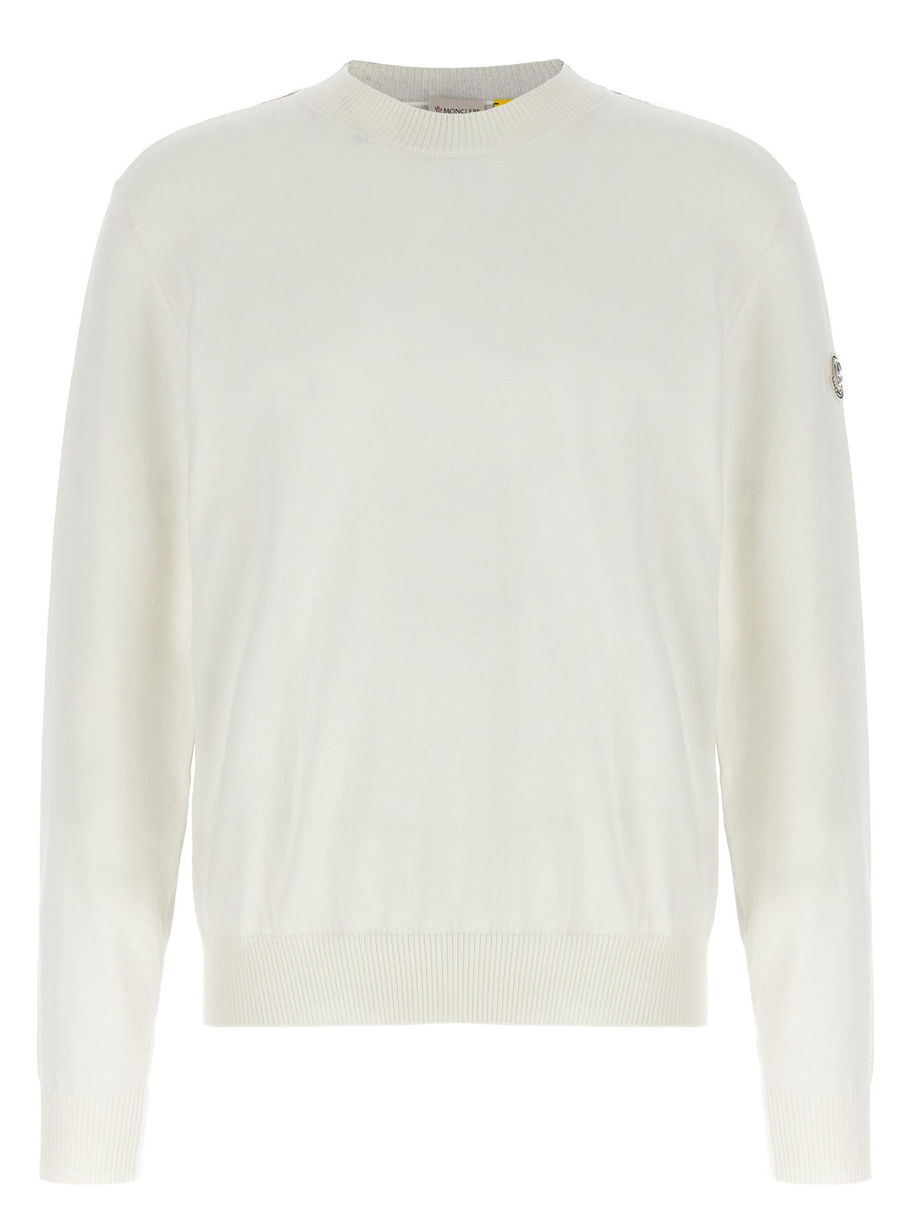 Cardigan en coton blanc MONCLER GENIUS porté, avec détails élégants et coupe décontractée, sur un fond neutre.