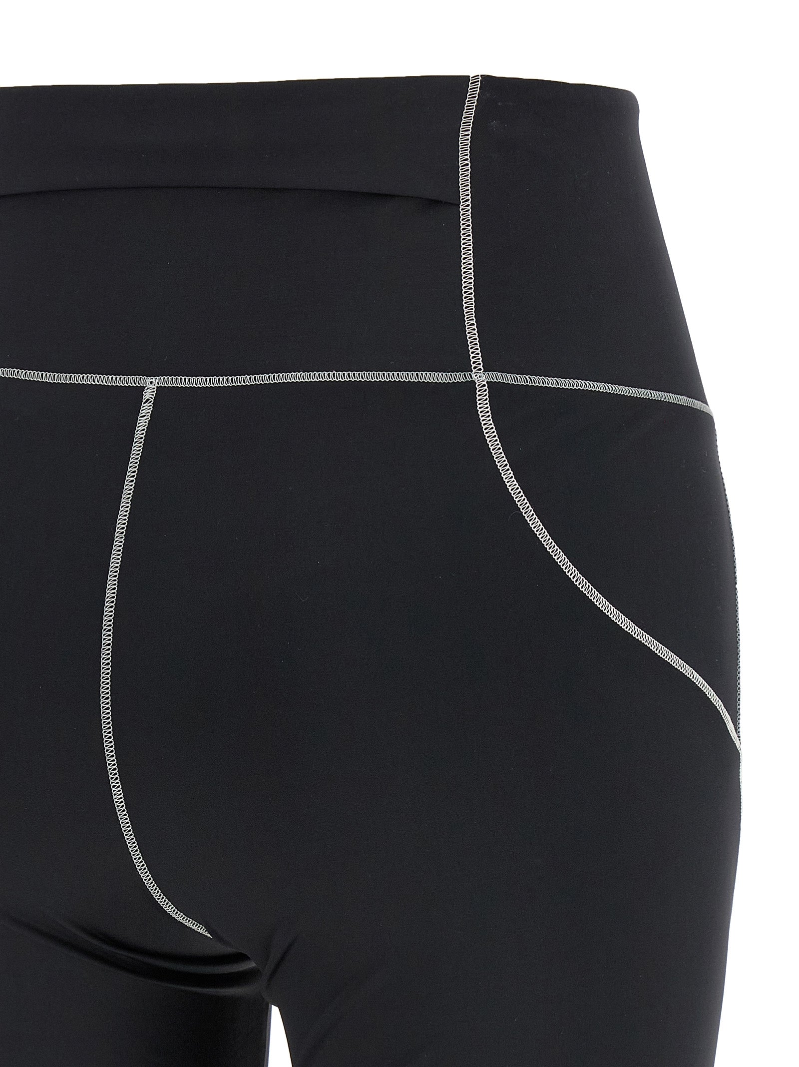 Leggings en polyamide noire Moncler Grenoble, ajustés, avec détails techniques visibles pour un look sportif et moderne.