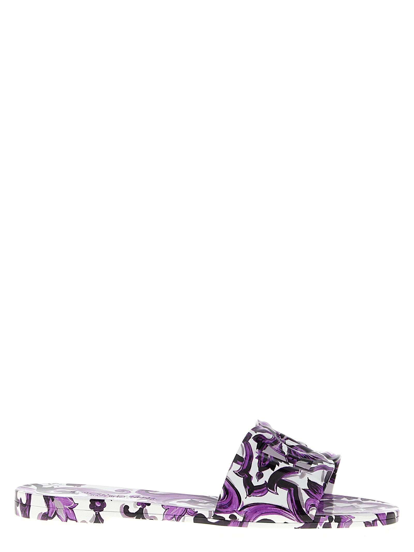 Sandales en plastique violettes Dolce & Gabbana, élégantes et confortables, visibles en gros plan sur fond neutre.