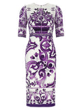Robe midi en soie violette de Dolce & Gabbana, élégante et fluide, portée sur un mannequin.