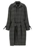 Manteau en laine noir Balenciaga avec col élégant et coupe structurée, présenté sur un fond neutre.