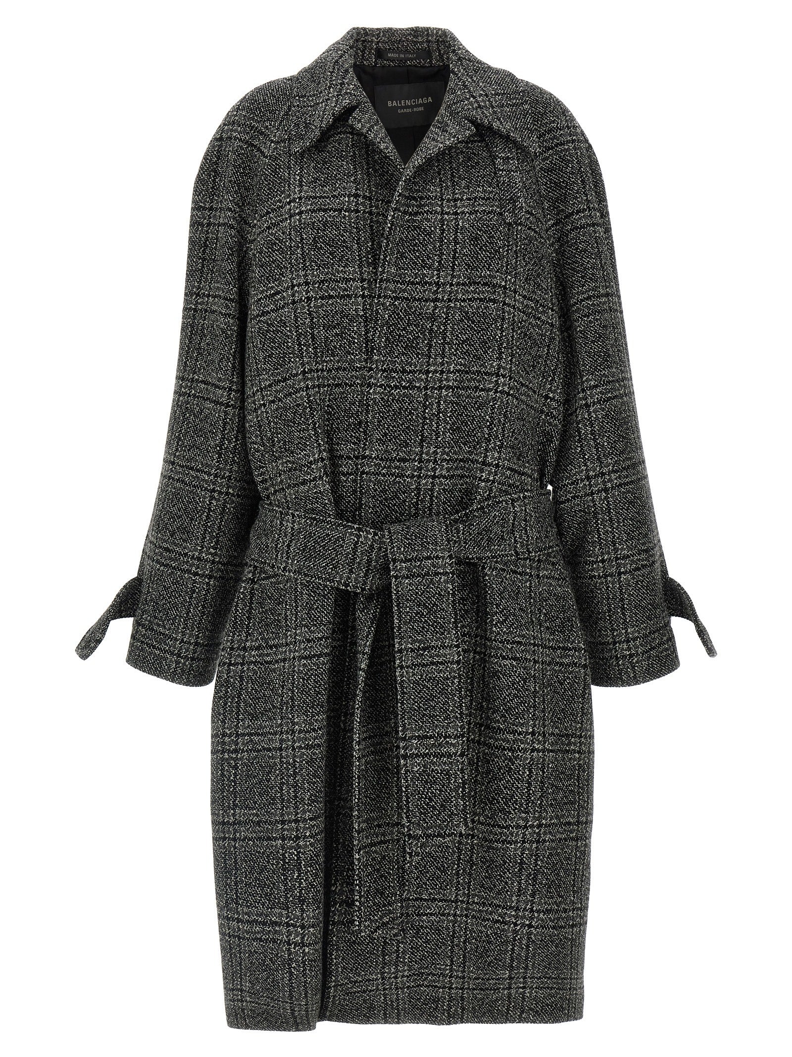 Manteau en laine noir Balenciaga avec col élégant et coupe structurée, présenté sur un fond neutre.