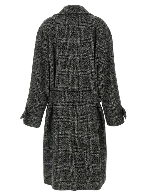 Manteau en laine noir Balenciaga, coupe élégante, porté sur un mannequin, détails de couture visibles.