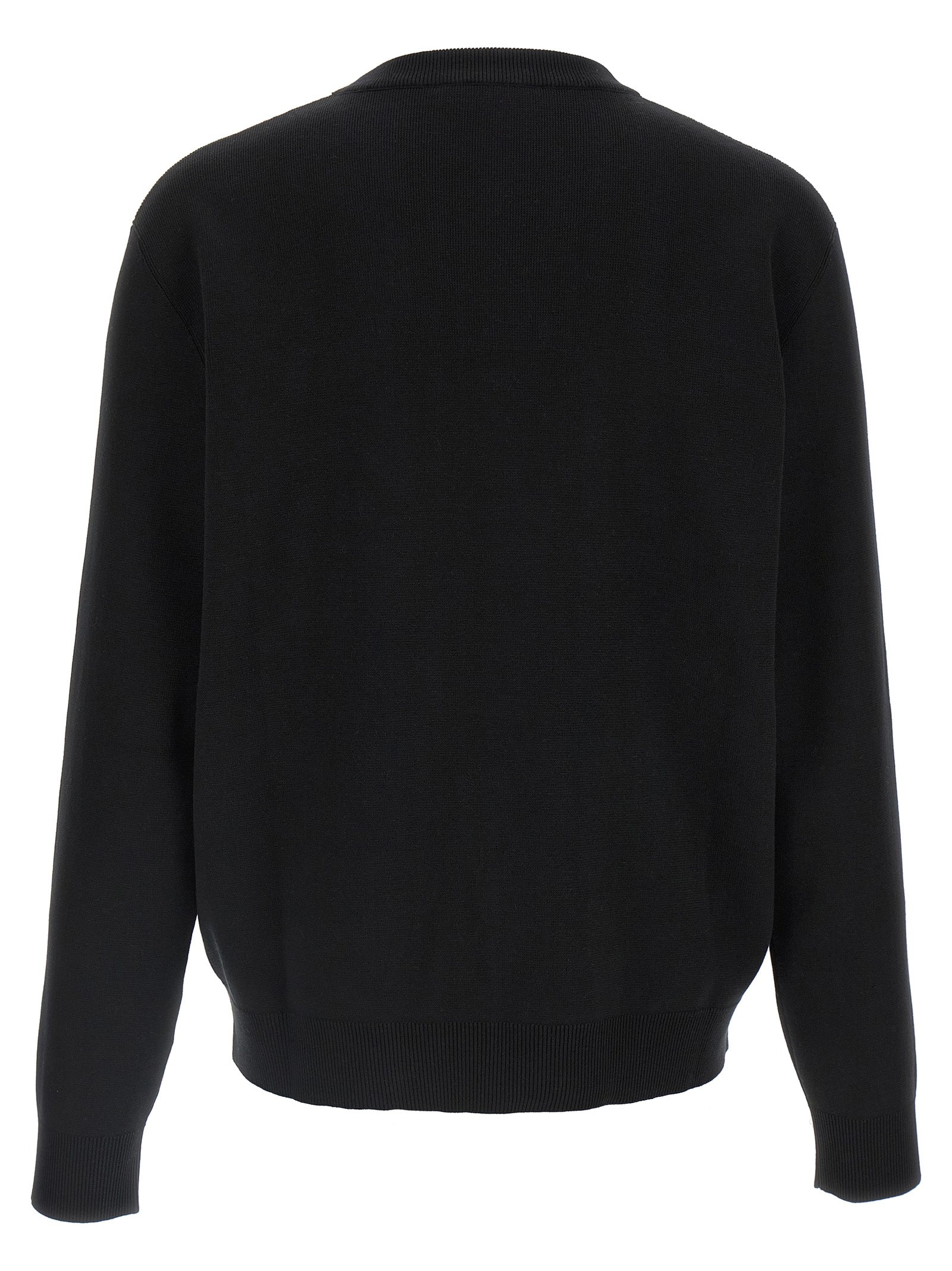Cardigan en laine bicolore Gucci, coupe tendance, avec détails élégants, porté par un mannequin.