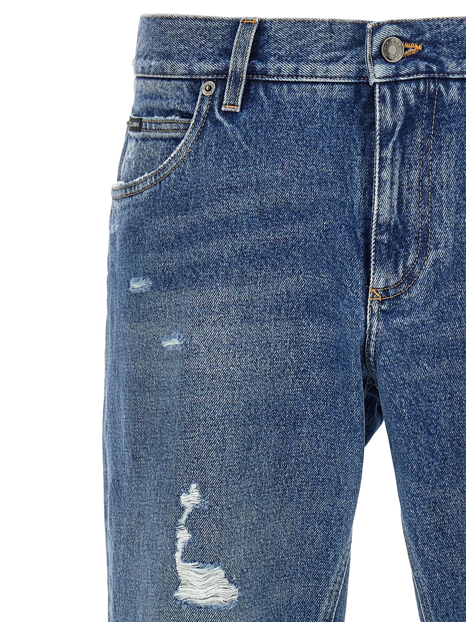 Jeans droits en coton bleu Dolce & Gabbana, style classique et coupe ajustée, visibles avec poches et fermeture à bouton.