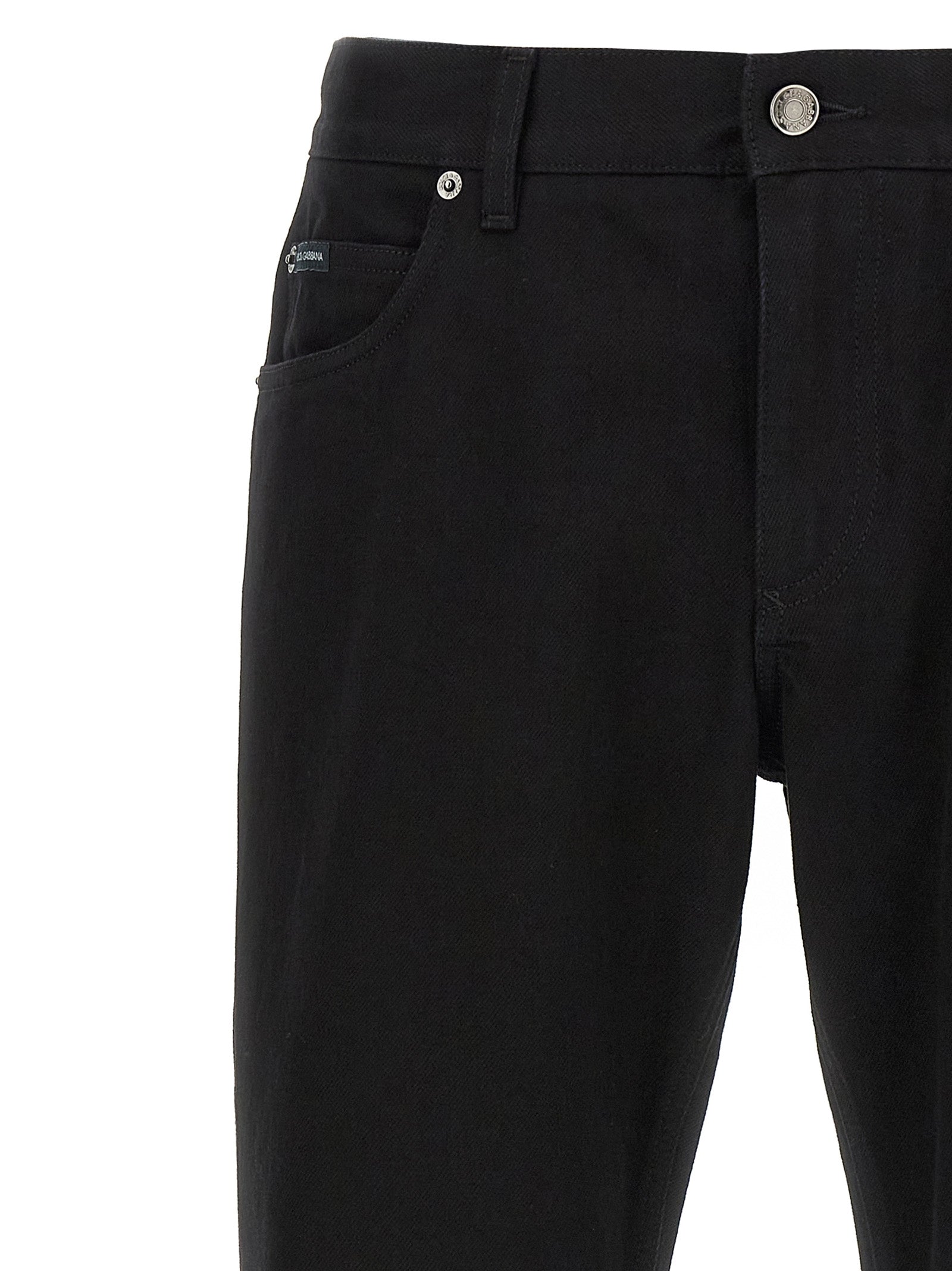 Jeans droits en coton noir de Dolce & Gabbana, style classique et coupe ajustée, visibles sur ce jean.