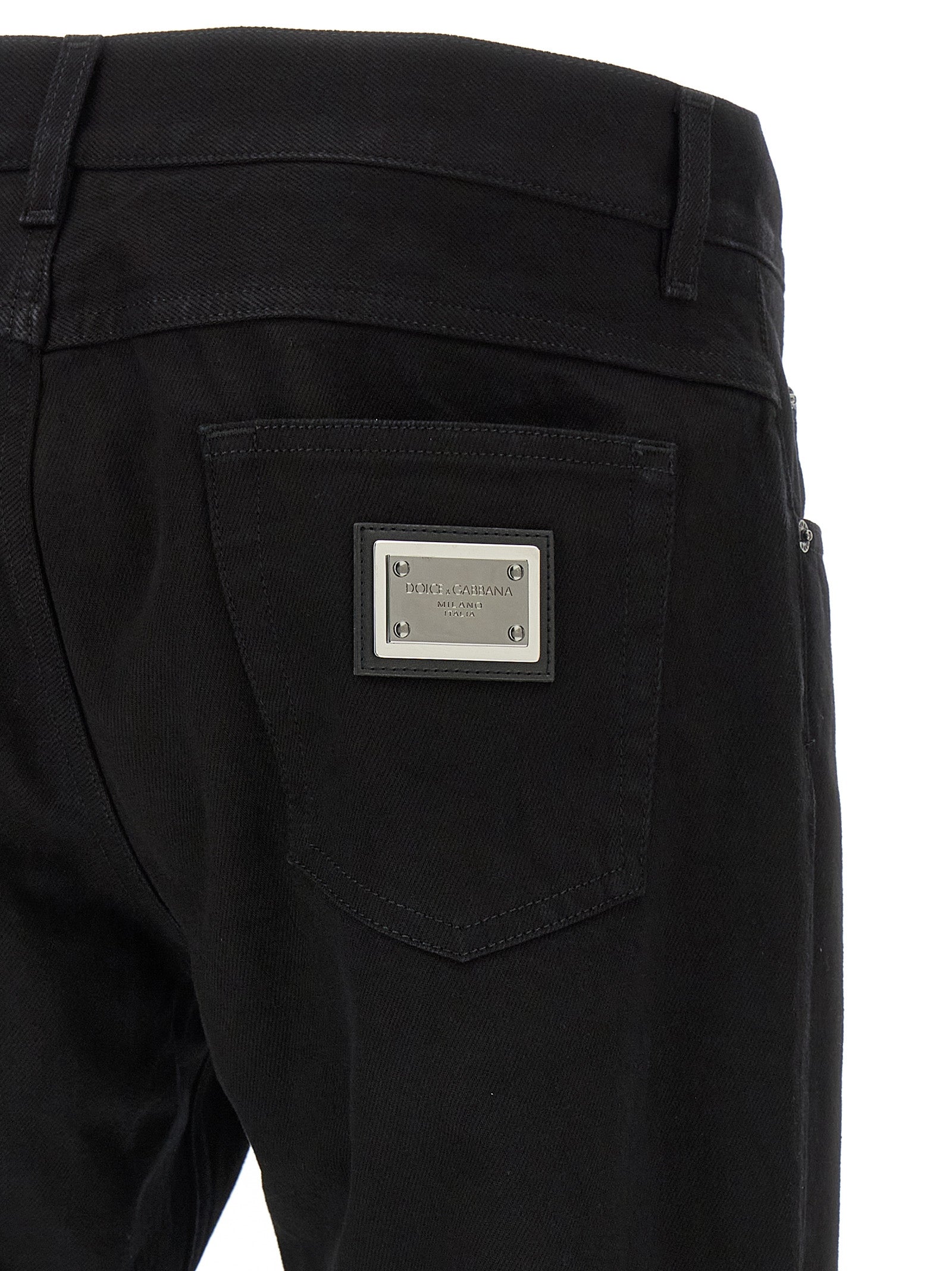 Jeans droits en coton noir de Dolce & Gabbana, pantalon casual élégant, visibles détails de couture et coupe droite.