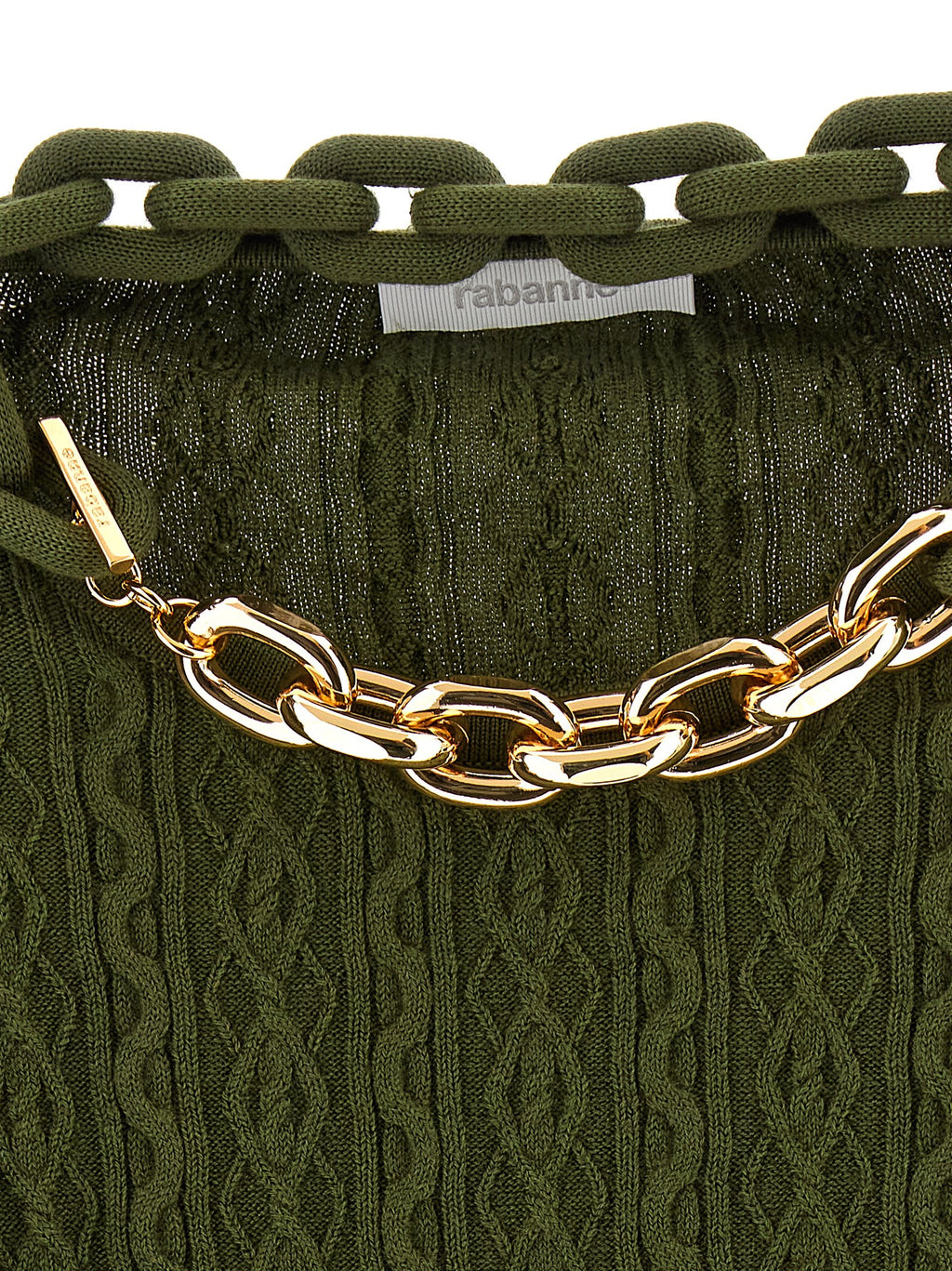 Cardigan en laine bicolore Paco Rabanne avec boutons, porté sur un mannequin dans une ambiance lumineuse.