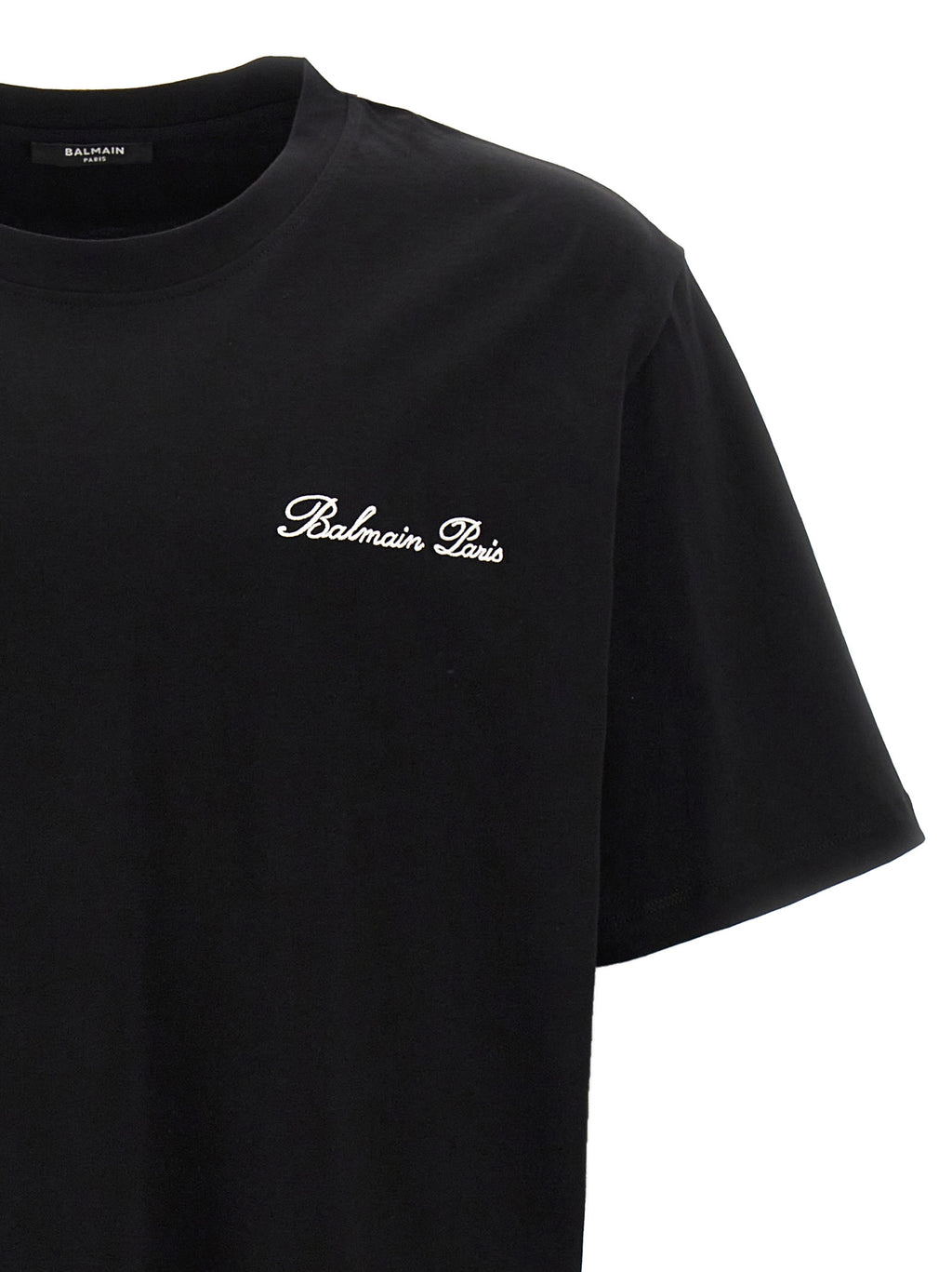 T-shirt en coton bicolore Balmain, coupe classique avec logo Balmain visible, porté de face, style élégant et moderne.
