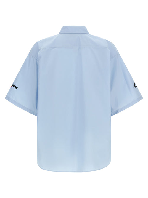 Chemise en coton bleue Balenciaga avec col classique et manches longues, vue de face.