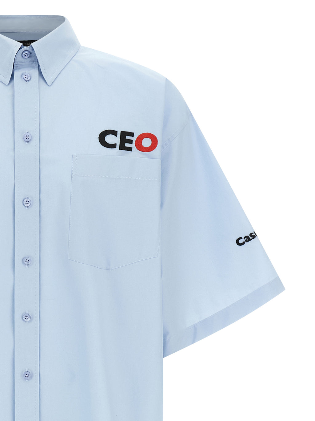 Blouse en coton bleu Balenciaga, style élégant avec col et manches longues, portée décontractée ou chic.
