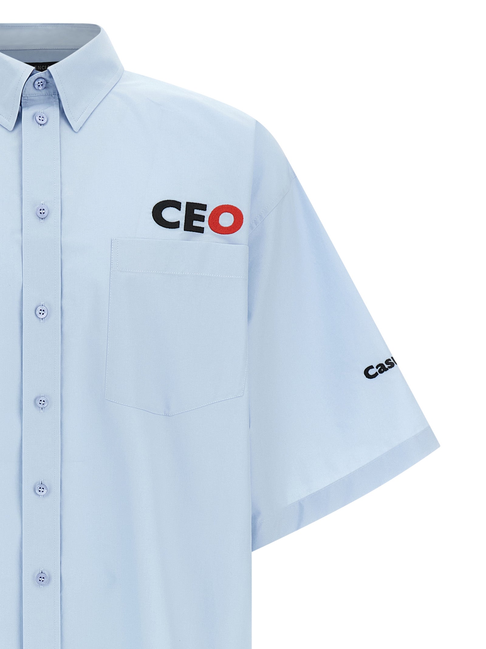 Blouse en coton bleu Balenciaga, style élégant avec col et manches longues, portée décontractée ou chic.