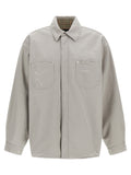 Chemisier gris en coton de la marque Balenciaga, montre le col, les manches longues et la coupe décontractée de la blouse.