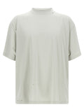 T-shirt beige en coton de la marque Balenciaga, coupe classique, visible sur un fond neutre.