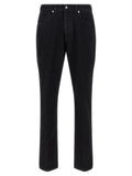 Jeans droits en coton noir de Givenchy, silhouette classique, vue de face avec détails de la coupe droite.
