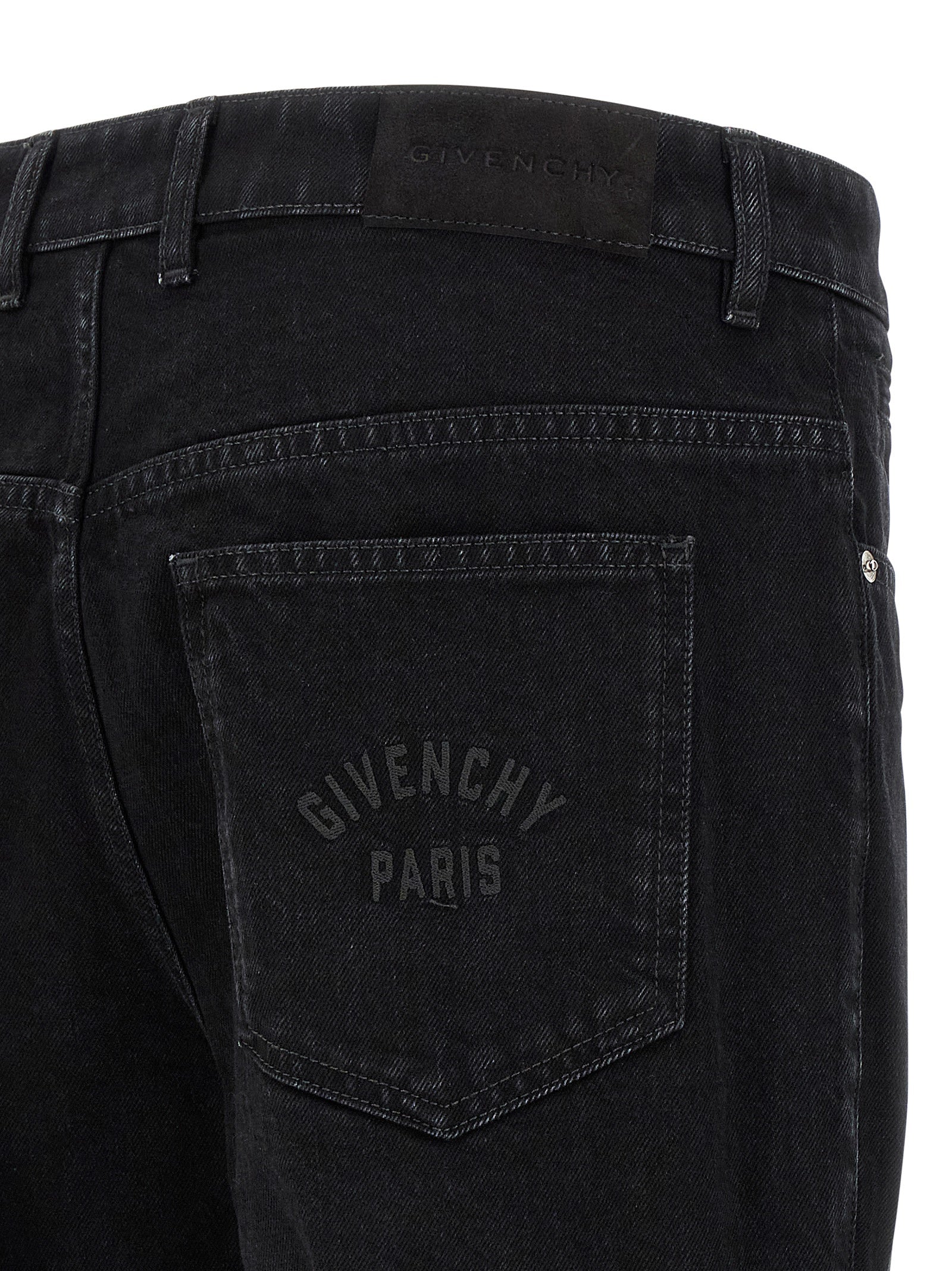 Jeans noirs en coton Givenchy, coupe droite, visibles avec détails de couture et ceinture classique.