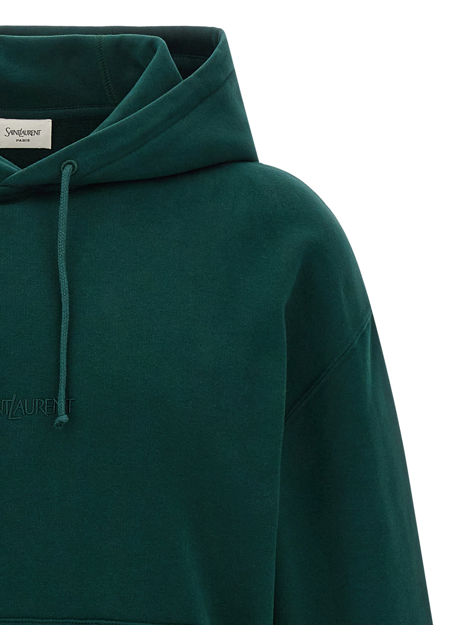 Sweat-shirt en coton bicolore de Saint Laurent, coupe décontractée, avec logo brodé, porté par un mannequin.
