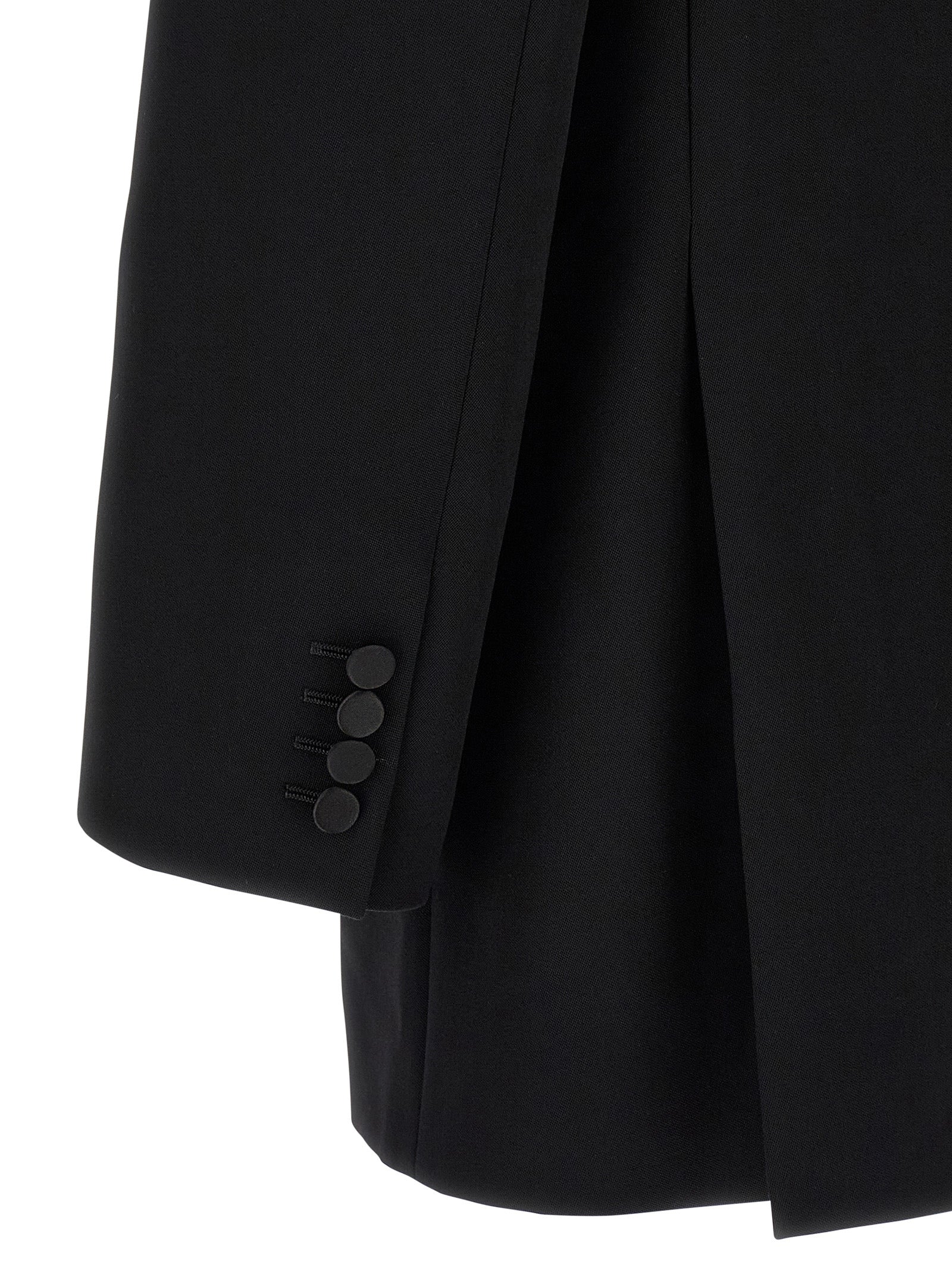 Veste blazer en laine noire Saint Laurent, coupe élégante, détails sophistiqués et finition soignée.