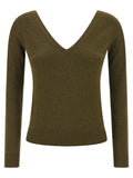 Cardigan bicolore en cachemire Saint Laurent porté, doux et élégant, avec boutons et coupe classique.
