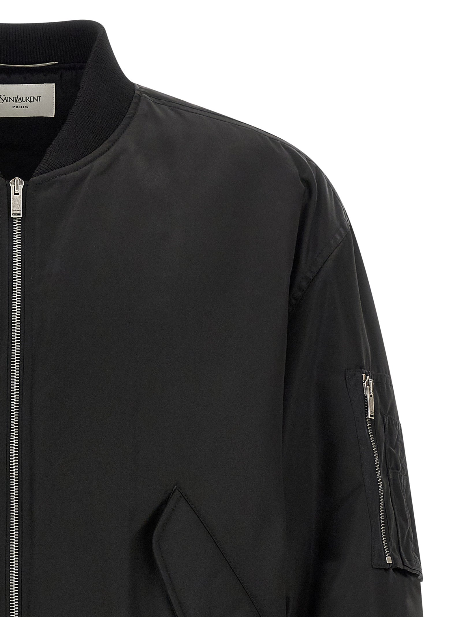 Veste bomber noire en polyamide de Saint Laurent, vue de face, avec détails de design élégants et fermeture éclair visible.