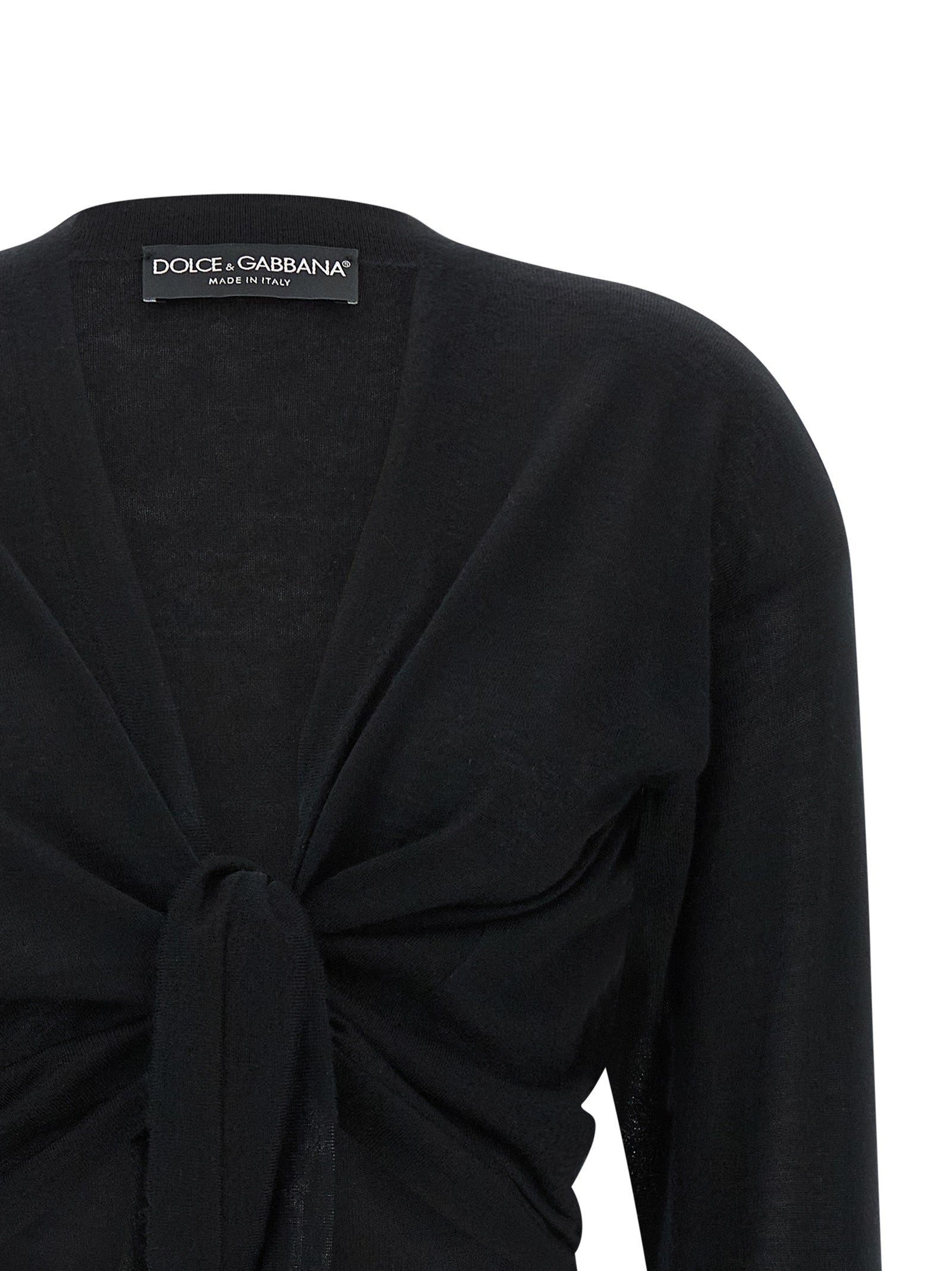 Cardigan en cachemire noir de Dolce & Gabbana, pull élégant avec boutons et finition douce, porté sur un mannequin.